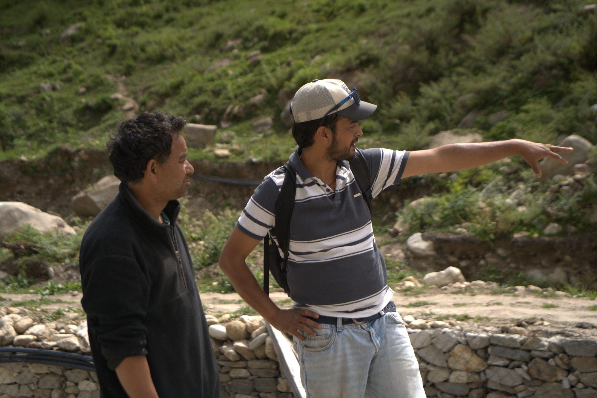 The guide pointing out the line of the trail to a guest