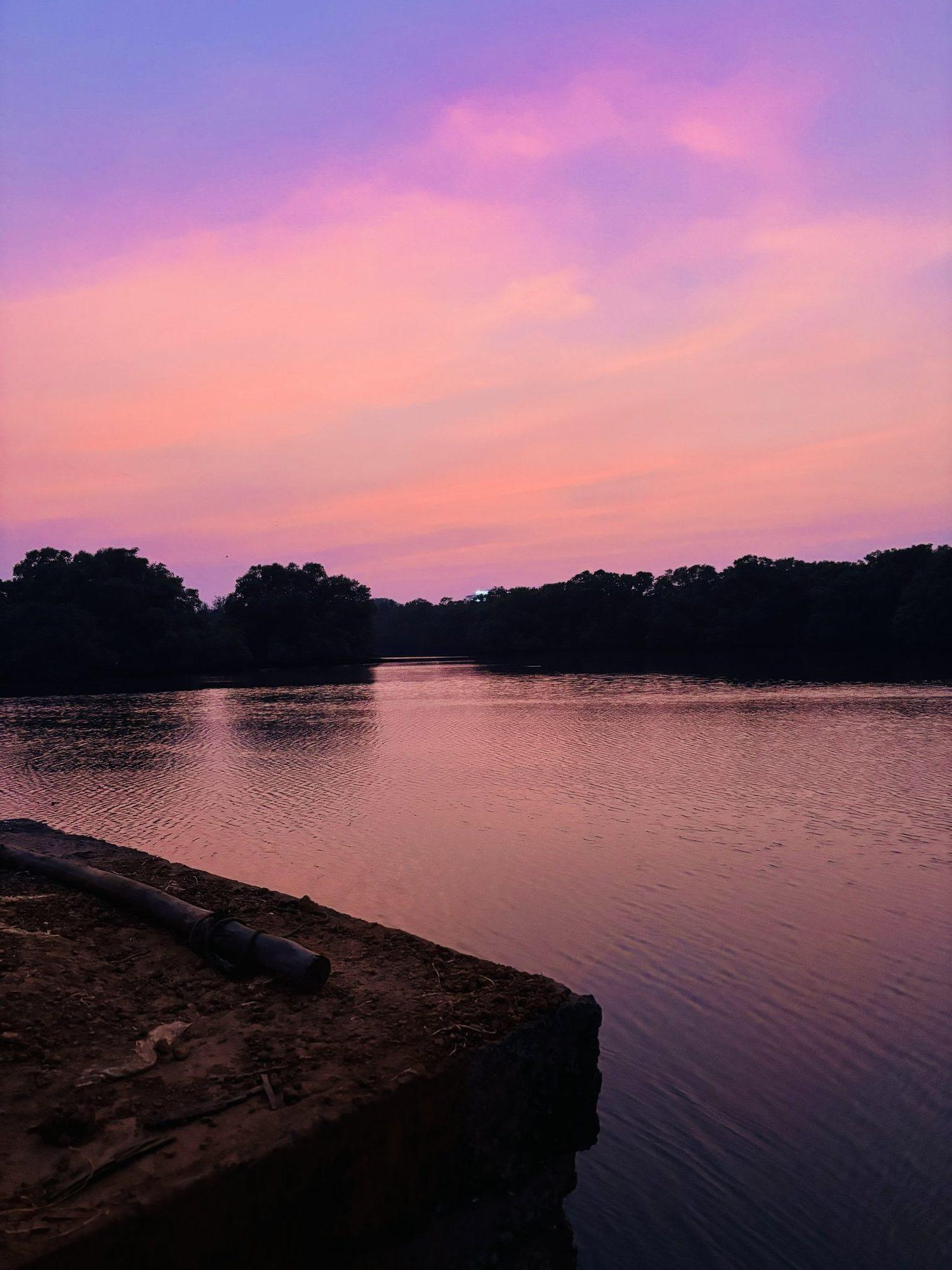 Pink and lilac sunset over the still backwater