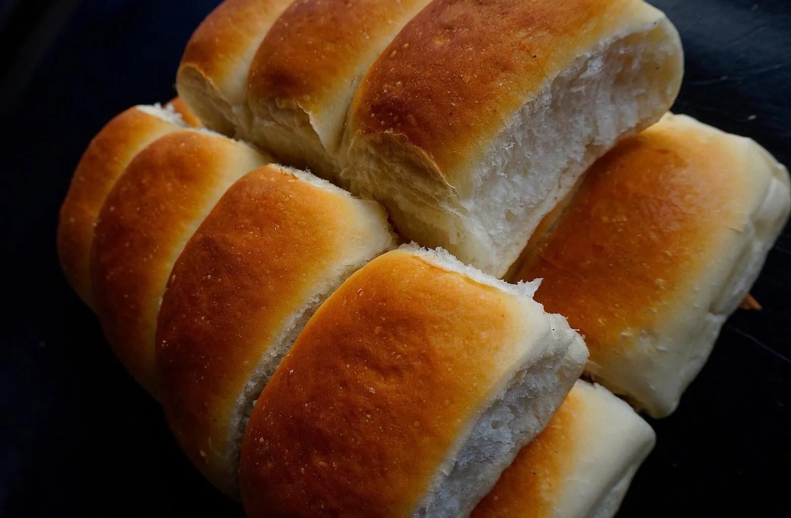 A stack of golden, soft traditional Goan pao bread rolls