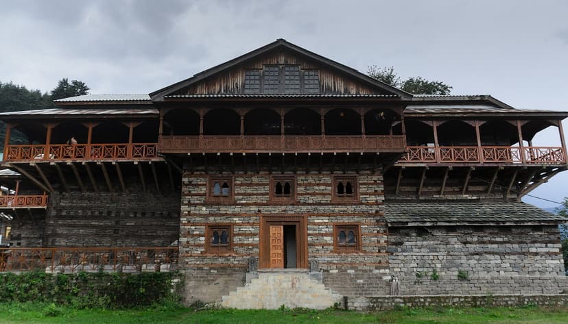 Naggar Castle in Kullu district — a 500-year-old kath-kuni castle with alternating wood-stone walls and cantilevered wooden balconies, now an HPTDC heritage hotel