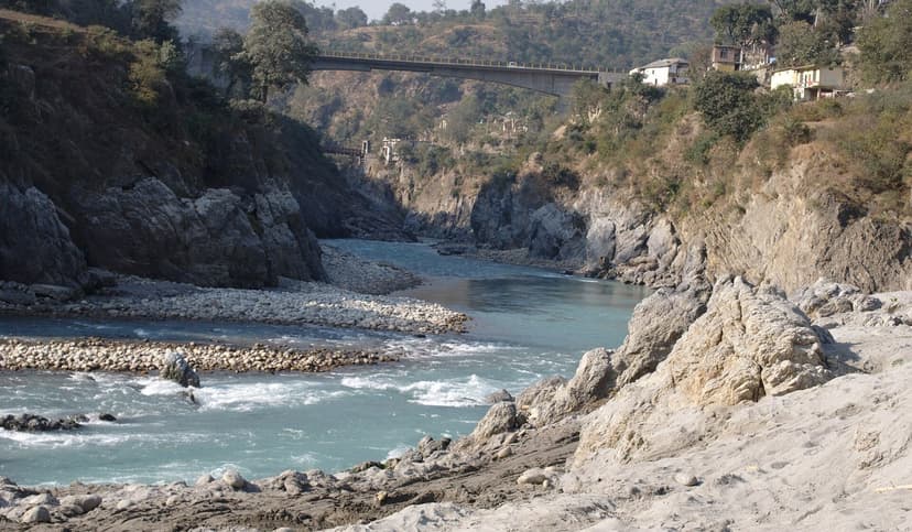 Sutlej River flowing under a road bridge near Tattapani with rocky banks