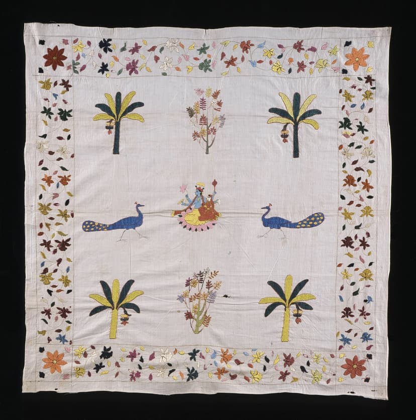 Chamba rumal with Krishna and Radha seated on a lotus flanked by two peacocks and four palm trees, sparse elegant composition on white cotton
