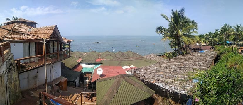The rooftops of the beach-shack strip at Curlies, Anjuna, above the sea
