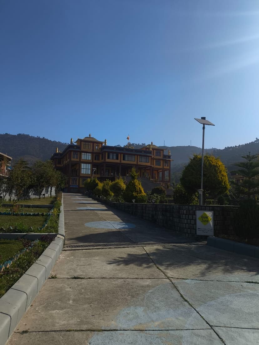 Khamgar Druk Dharmakara College building with Tibetan architecture at Tashi Jong monastery complex near Palampur under a clear blue sky