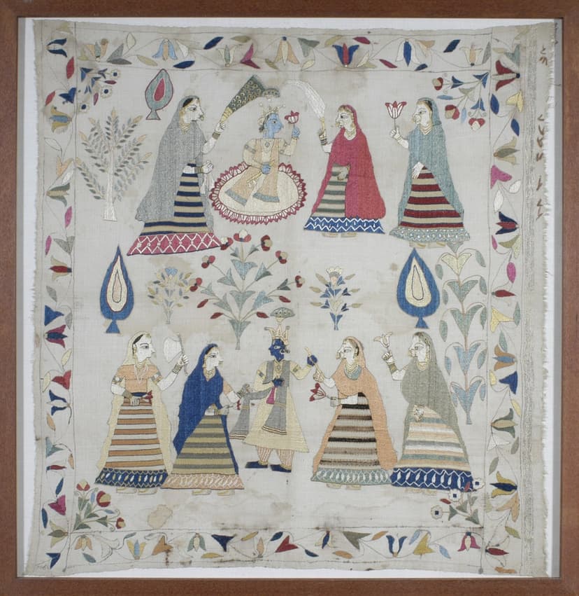 Chamba rumal showing gopis adoring a dancing Krishna, two rows of women in embroidered skirts around a central blue figure, floral border
