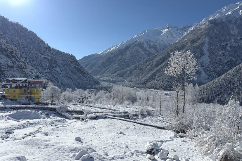 Sangla valley in Kinnaur under snow with the Baspa river and Himalayan peaks, home of the Phulaich flower festival