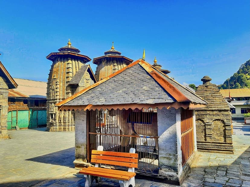 Lakshmi Narayan temple complex in Chamba showing multiple stone shikhara towers and a small pavilion shrine in the courtyard