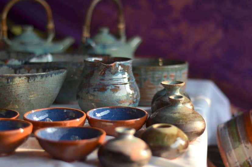 Andretta blue and brown pottery bowls and teapots on a display table