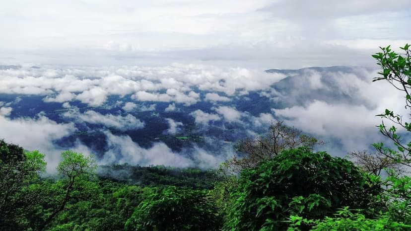 Monsoon cloud pouring over green forested hills of the Chorla ghats on Goa's eastern edge