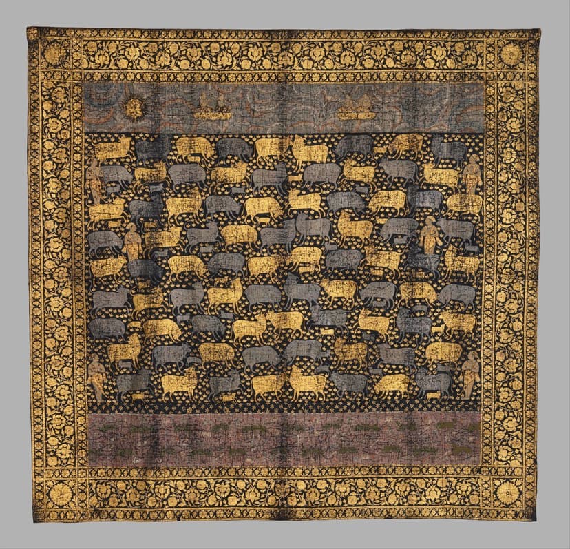 Historic near-square indigo textile with repeated gold and pale cows inside an ornamental border.