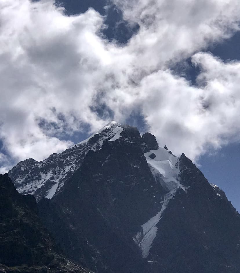 Manimahesh Kailash Peak summit close-up against monsoon clouds in Chamba district