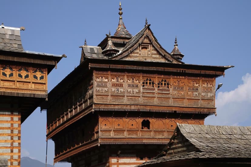 Bhimakali Temple tower at Sarahan — 800-year-old kath-kuni construction with ornate wooden balconies and slate roof that tilted during the 1905 Kangra earthquake and straightened itself in the aftershock