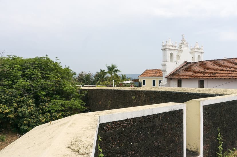 The ramparts of Fort Tiracol with the white St Anthony church inside the walls, North Goa