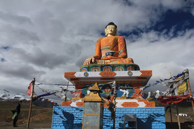 The large golden Buddha statue at Langza village under dramatic Spiti skies