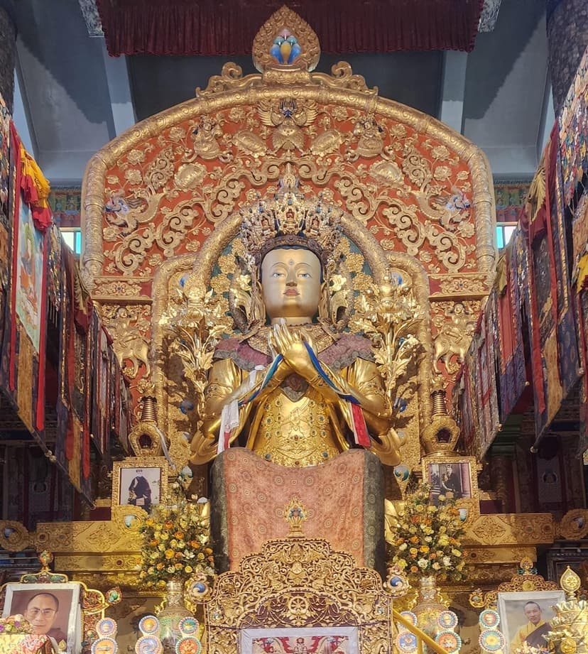 Gilded seated Buddha inside the inner sanctum of Sherabling Monastery