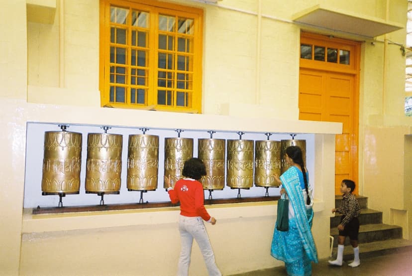 Visitors spinning prayer wheels at Namgyal Monastery, the Dalai Lamas personal monastery in Dharamshala