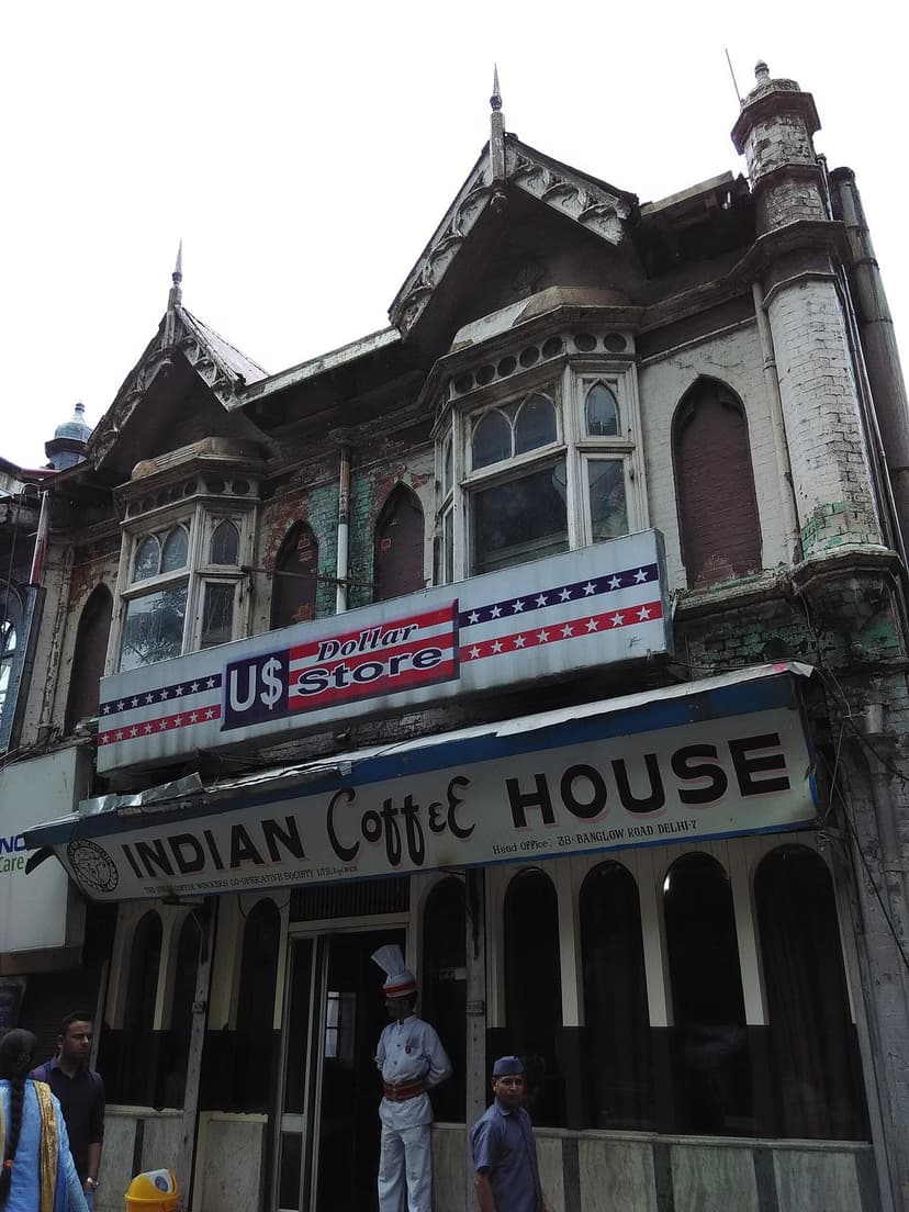 Exterior of Indian Coffee House on Mall Road Shimla — colonial-era building with large signboard reading INDIAN Coffee HOUSE, people walking past on the street